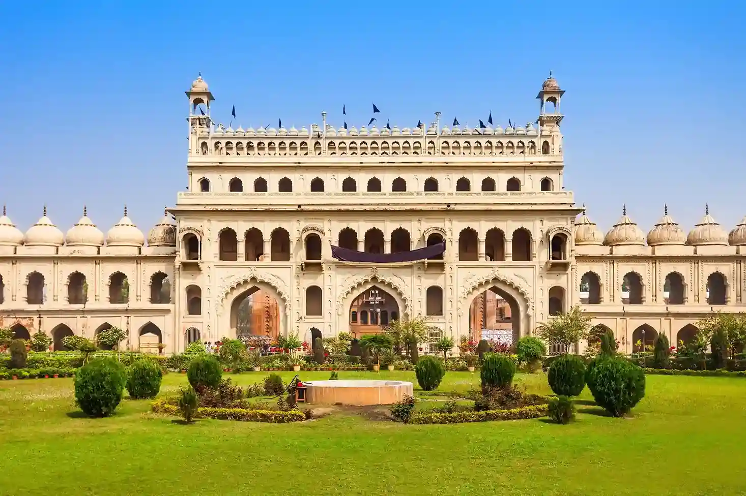 The front side of Bara Imambara, situated in Lucknow, UP, with a lush green courtyard in the front. 